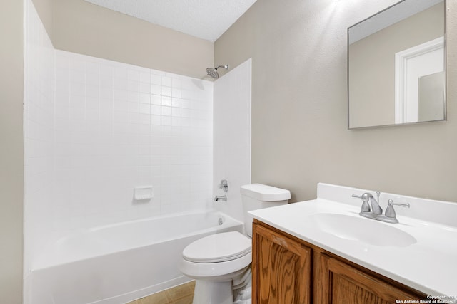 full bathroom featuring vanity, a textured ceiling, washtub / shower combination, and toilet