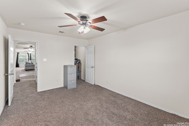 unfurnished bedroom with carpet and ceiling fan