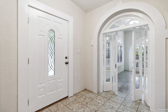 entryway featuring light tile patterned flooring