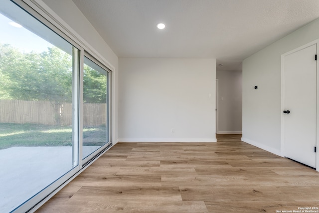 empty room with light wood-type flooring