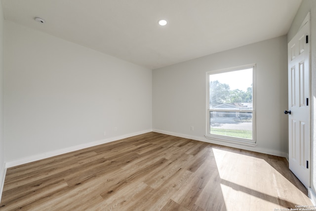 spare room featuring light hardwood / wood-style flooring