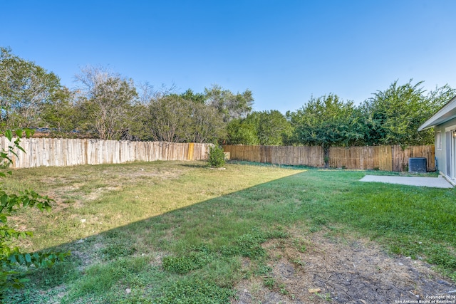 view of yard featuring a patio area and central AC