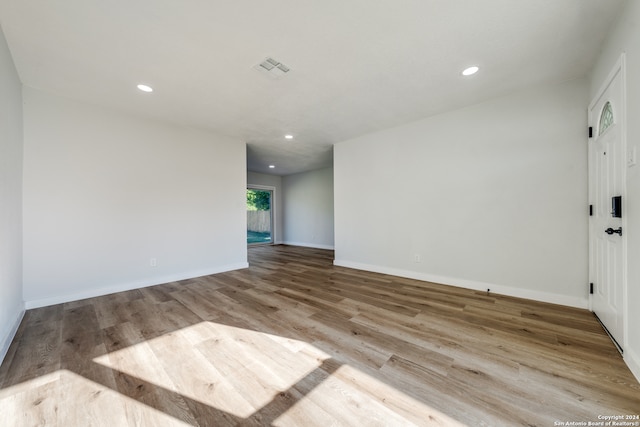 unfurnished room featuring light hardwood / wood-style floors