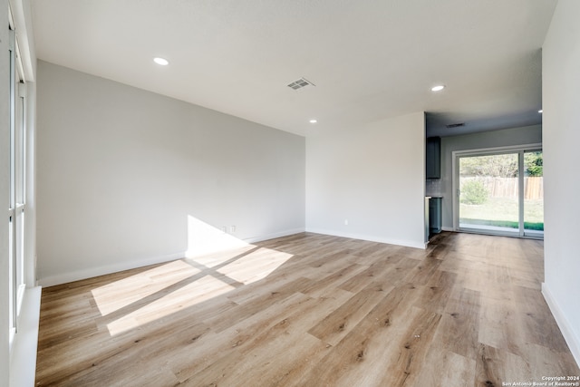 unfurnished room featuring light wood-type flooring