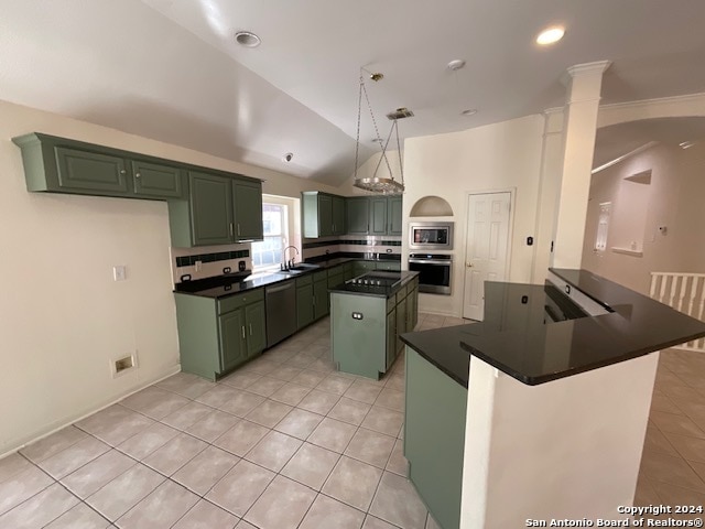 kitchen featuring green cabinets, a center island, and appliances with stainless steel finishes