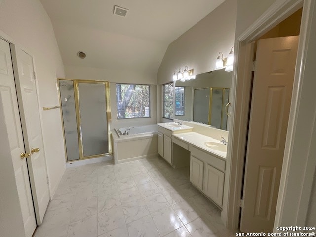 bathroom featuring plus walk in shower, lofted ceiling, and vanity