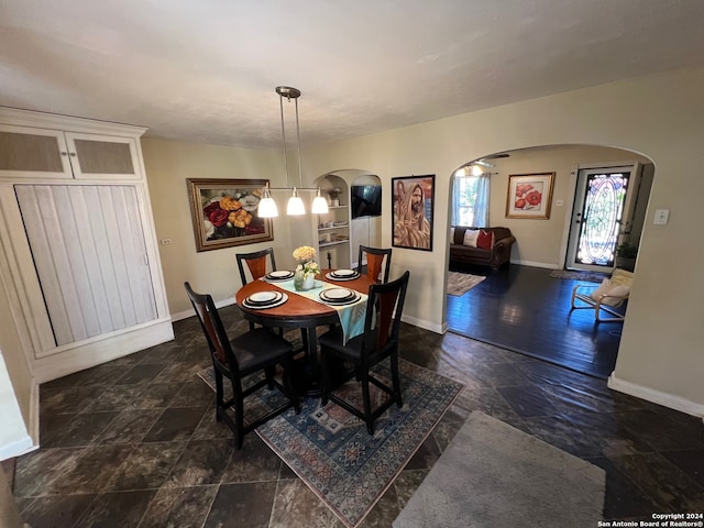 dining area featuring dark hardwood / wood-style floors and a chandelier