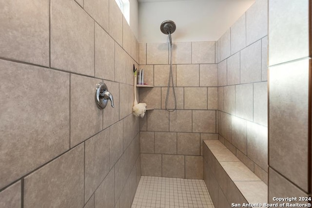 bathroom with a tile shower