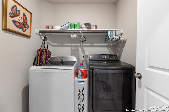 washroom featuring washer and dryer