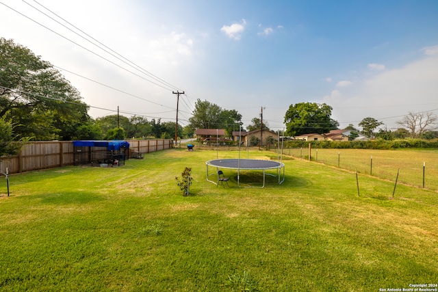 view of yard with a trampoline