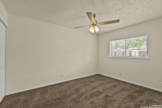 carpeted empty room with a textured ceiling and ceiling fan