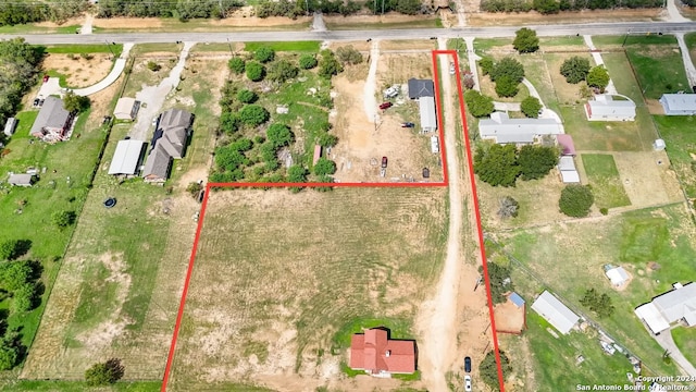 birds eye view of property with a rural view