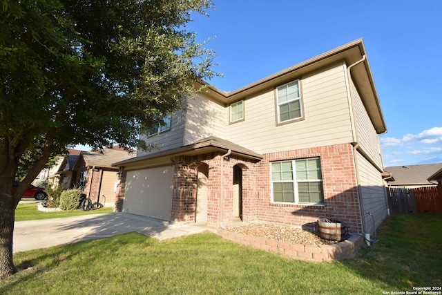 view of front facade with a garage and a front yard