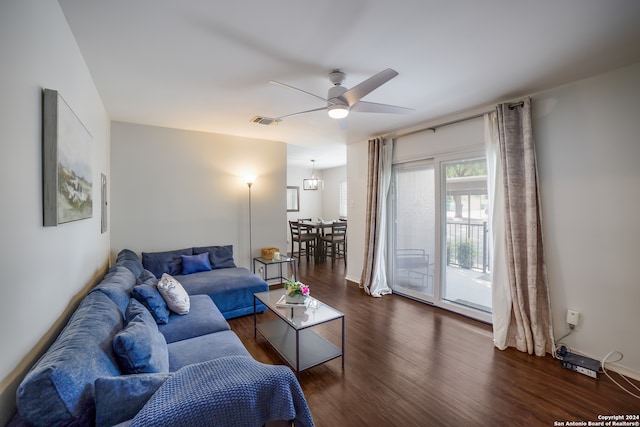 living room featuring dark hardwood / wood-style floors and ceiling fan