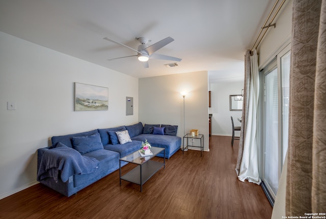 living room with ceiling fan, electric panel, and dark hardwood / wood-style flooring