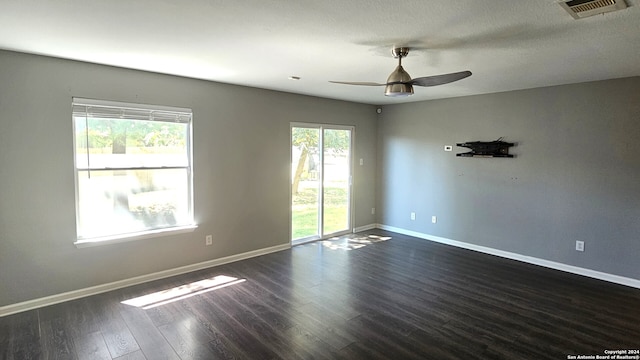 unfurnished room featuring ceiling fan and dark hardwood / wood-style floors