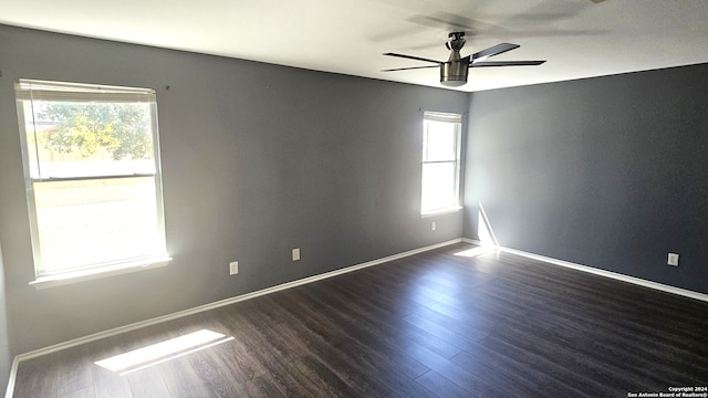 empty room featuring dark hardwood / wood-style floors and ceiling fan