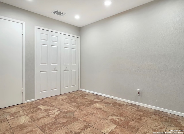 unfurnished bedroom featuring a closet