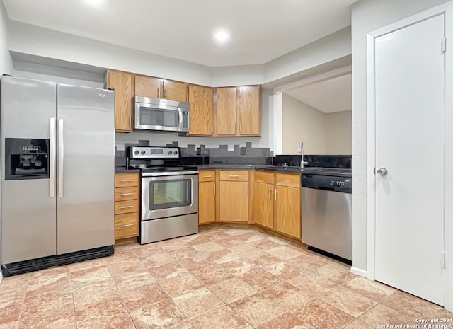 kitchen with appliances with stainless steel finishes and sink