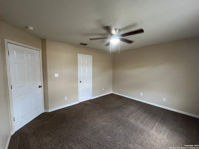 carpeted empty room with ceiling fan