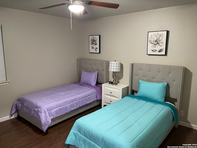 bedroom featuring dark hardwood / wood-style flooring and ceiling fan