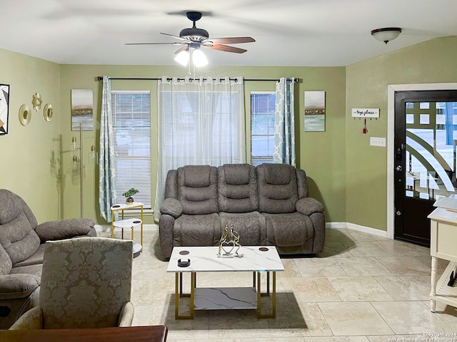 living room with ceiling fan and plenty of natural light