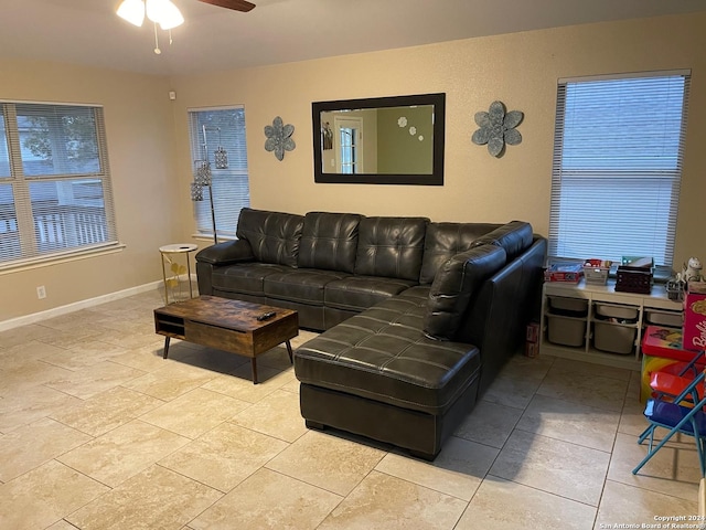 living room featuring ceiling fan and light tile patterned floors