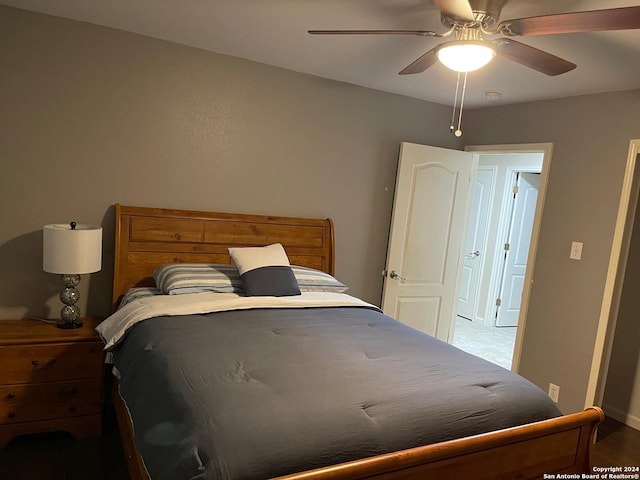 bedroom with ceiling fan and hardwood / wood-style floors