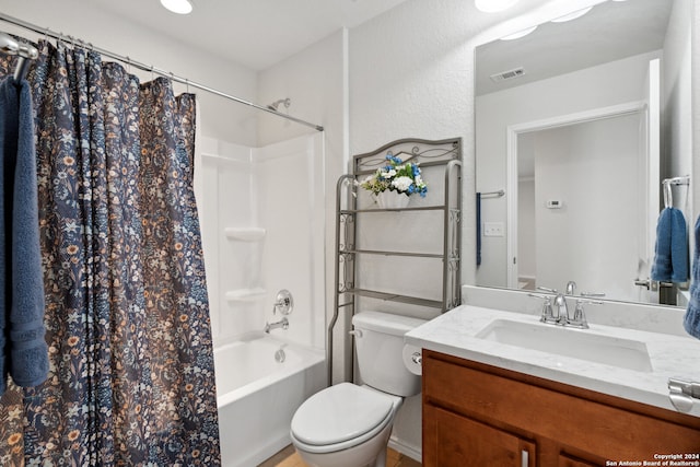 full bathroom featuring vanity, toilet, and shower / tub combo with curtain