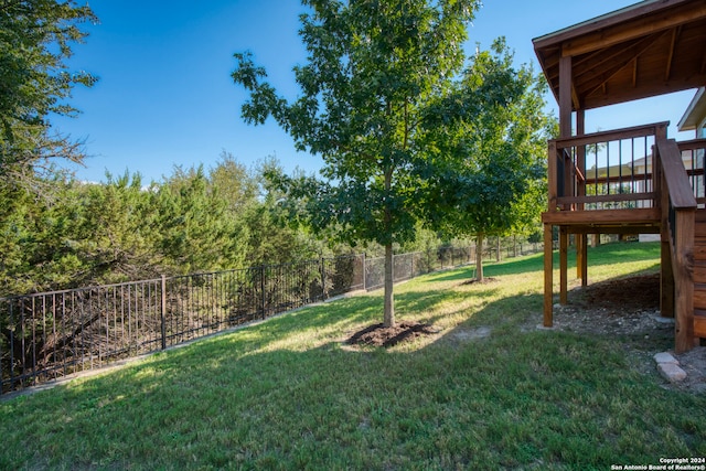 view of yard with a wooden deck