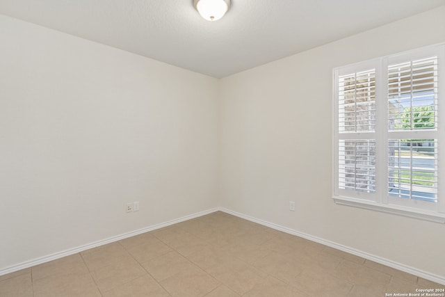 view of tiled spare room