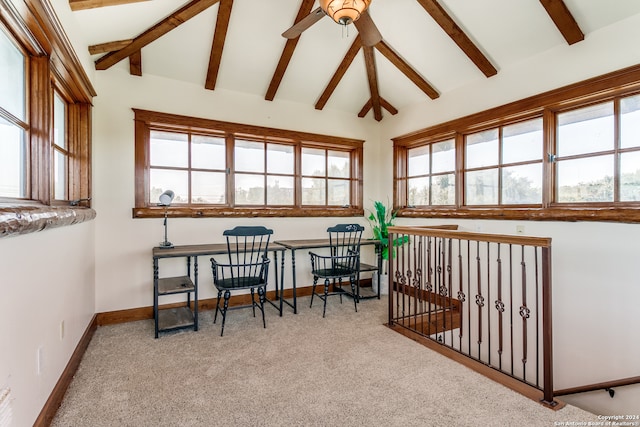 interior space featuring vaulted ceiling with beams, light colored carpet, ceiling fan, and a healthy amount of sunlight