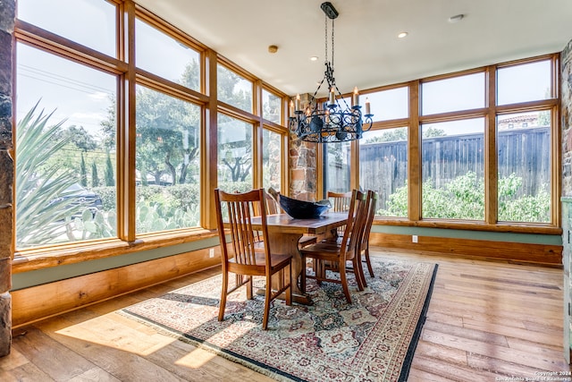 dining room featuring light hardwood / wood-style flooring and a chandelier