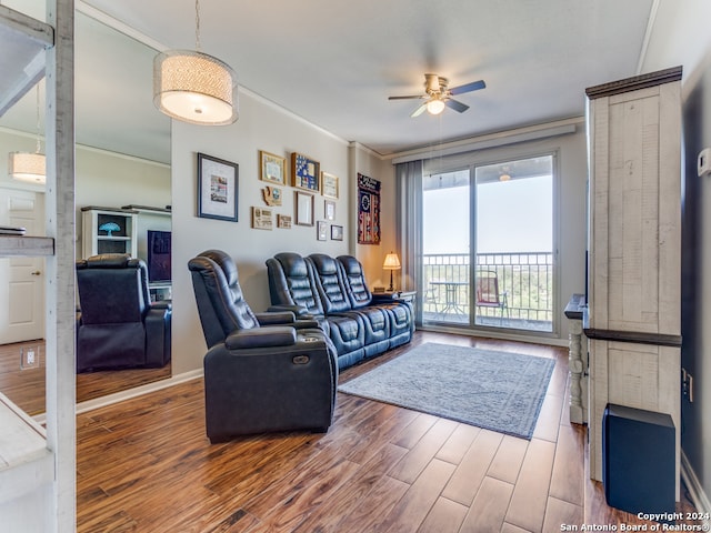 living room featuring ceiling fan, hardwood / wood-style flooring, and ornamental molding