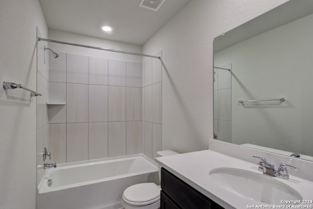 full bathroom featuring vanity, toilet, and tiled shower / bath