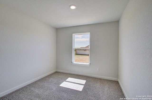 unfurnished room featuring carpet floors