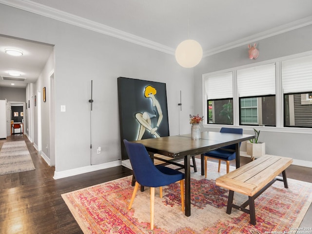 dining space featuring dark hardwood / wood-style floors and ornamental molding