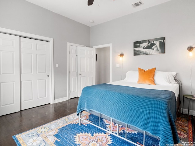 bedroom with ceiling fan, a closet, and dark hardwood / wood-style floors