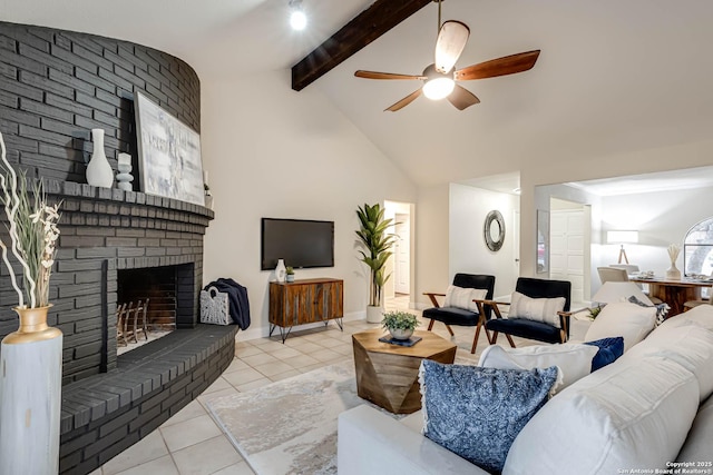 tiled living room with a brick fireplace, lofted ceiling with beams, and ceiling fan