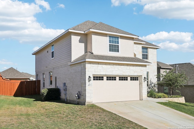 view of front of home with a garage and a front yard