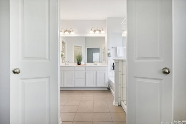 bathroom with shower with separate bathtub, vanity, and tile patterned floors