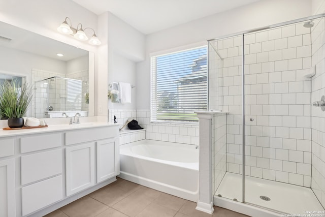 bathroom featuring vanity, plus walk in shower, and tile patterned floors