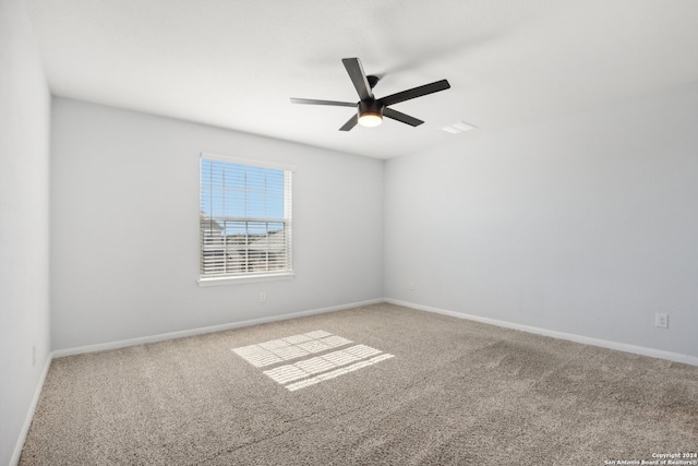 empty room with carpet and ceiling fan