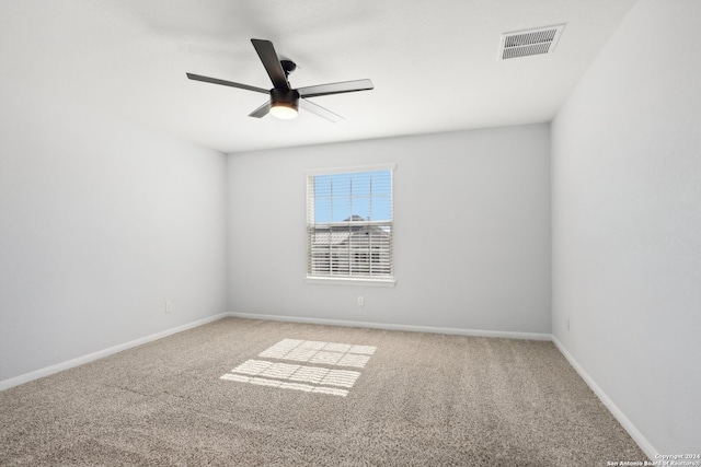 empty room featuring ceiling fan and carpet flooring