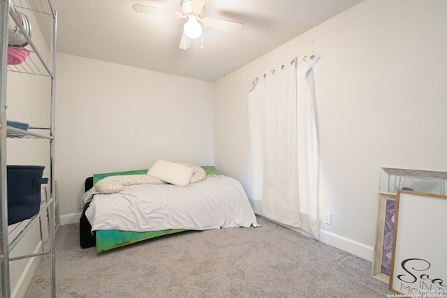 bedroom with ceiling fan and carpet flooring