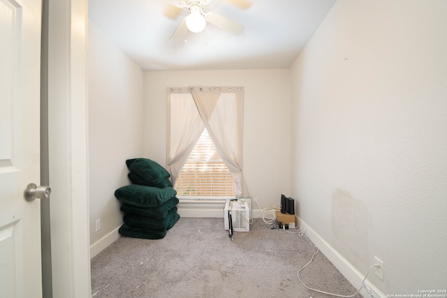 sitting room featuring ceiling fan and light colored carpet