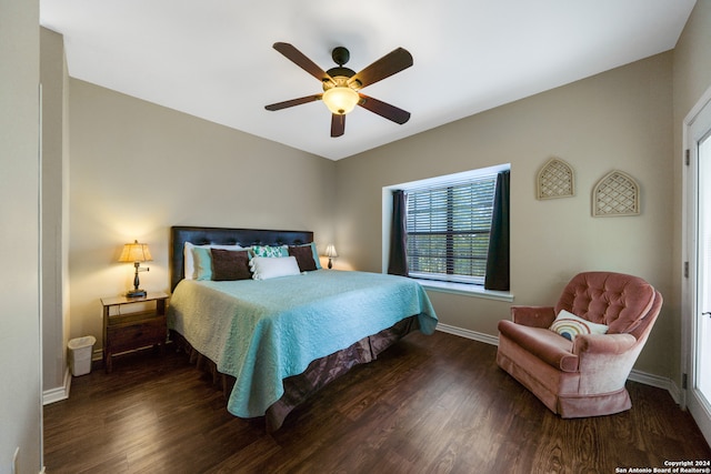 bedroom with ceiling fan and dark wood-type flooring