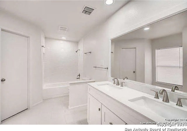 bathroom with shower / tub combination and vanity