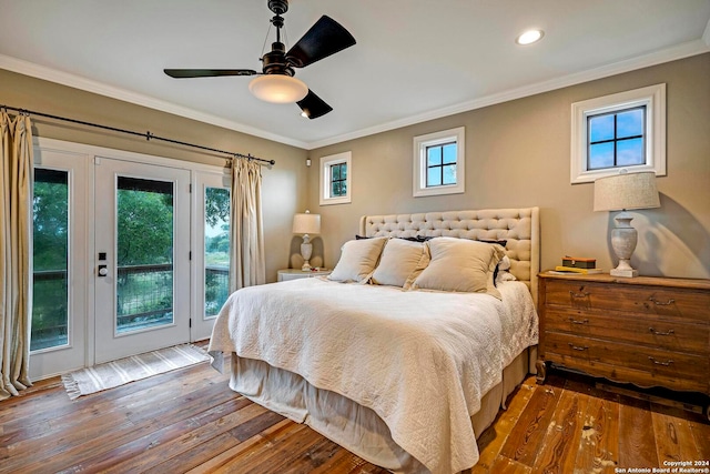 bedroom featuring ceiling fan, hardwood / wood-style flooring, access to outside, and multiple windows