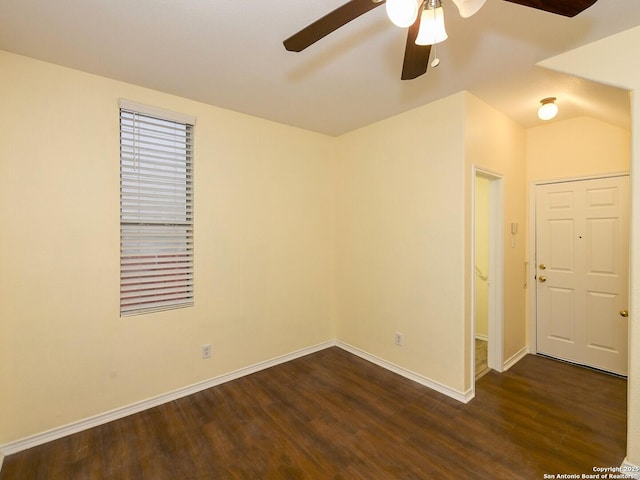 spare room with ceiling fan and dark hardwood / wood-style flooring